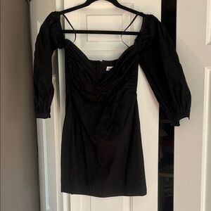 Across the shoulder black mini dress